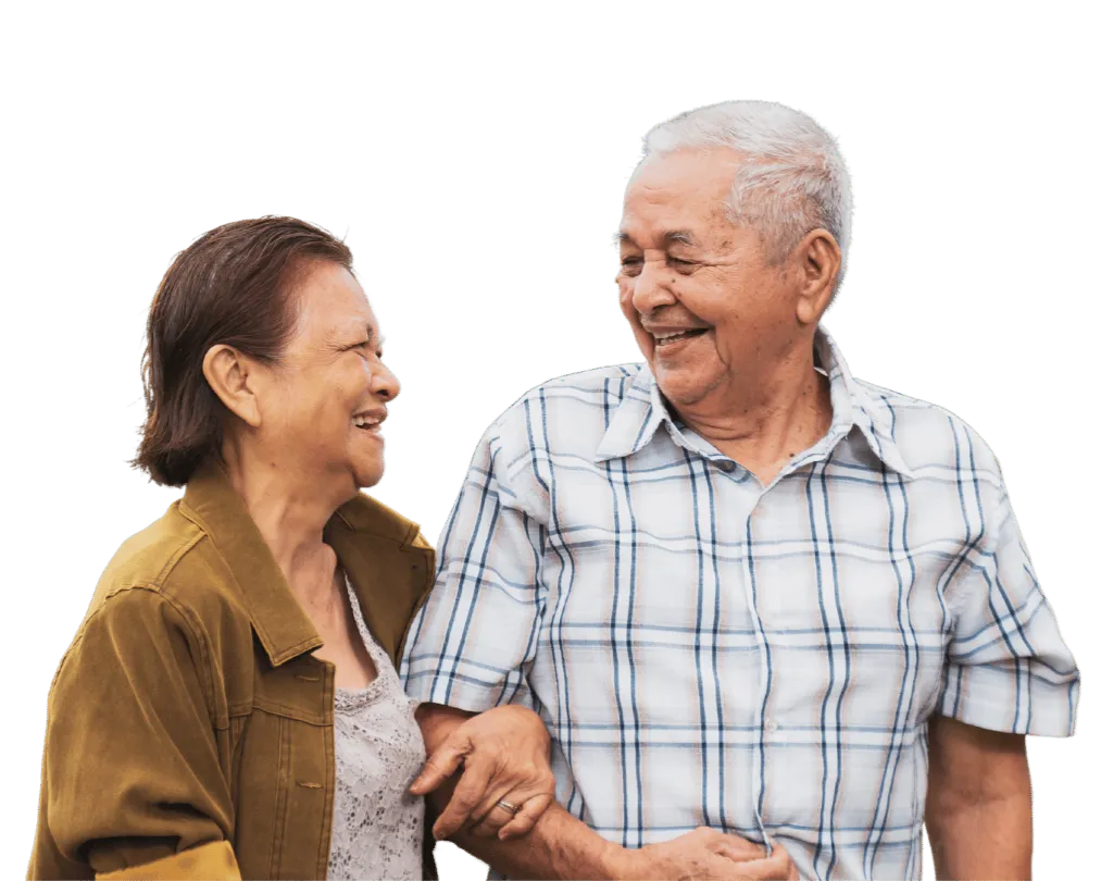 Elderly couple smiling and holding hands, representing companionship and support during senior relocation services.