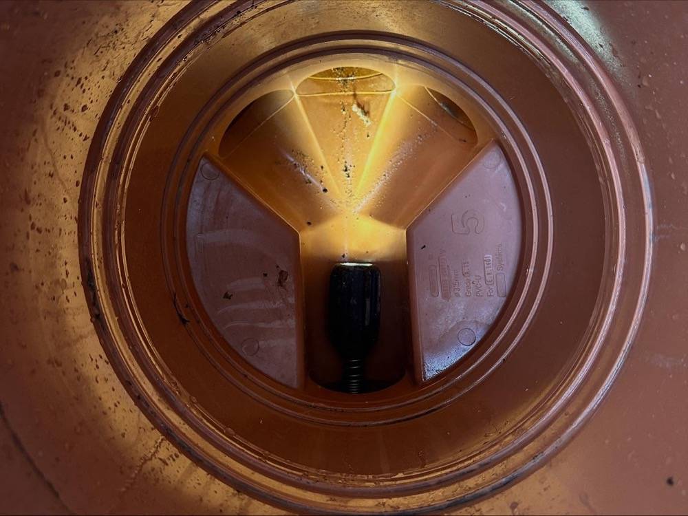 Interior view of a newly lined drainage pipe showing smooth bore finish