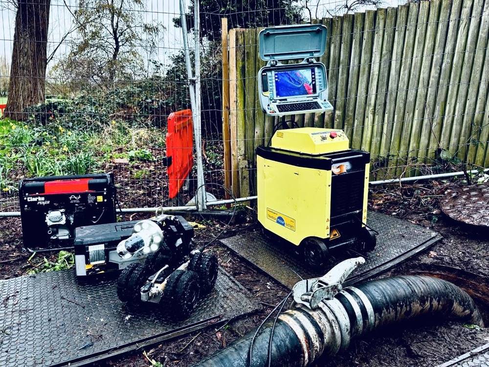 CCTV drain survey equipment including yellow control unit, monitor screen and crawler robot