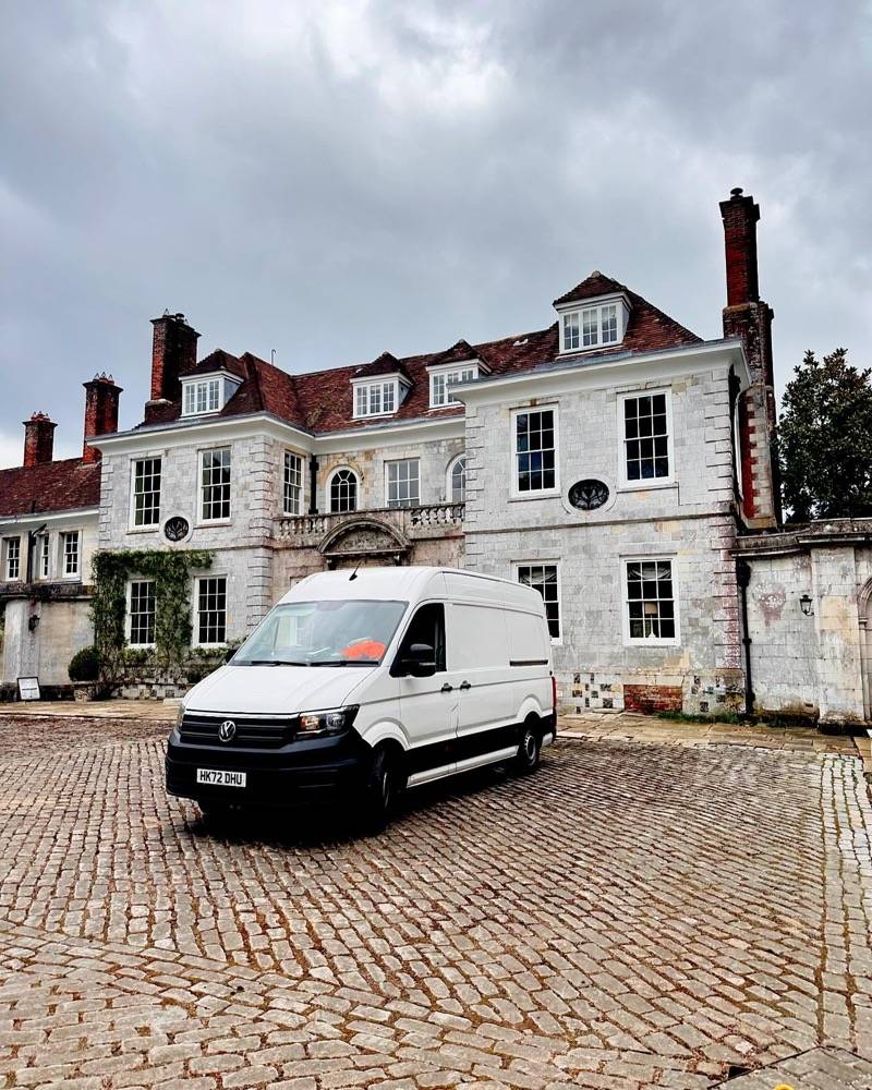UK Drain Services van outside a grand manor house conducting drainage survey work