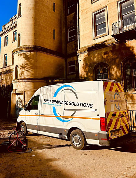 Plumber with customer n the kitchen