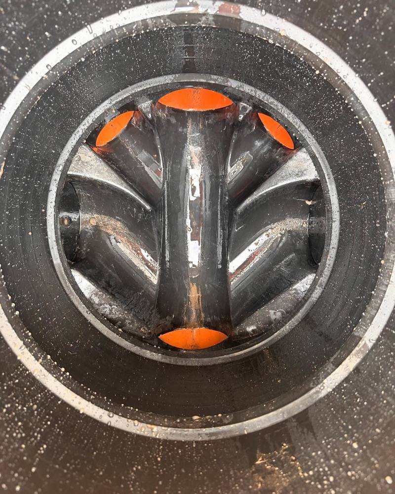 New plastic pipe junction with capped branch inlets installed during a no-dig drain repair