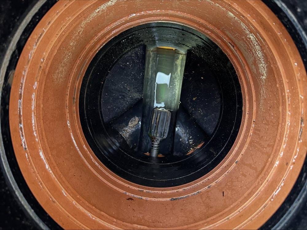 Clay drainage pipe with liner insert visible inside the bore