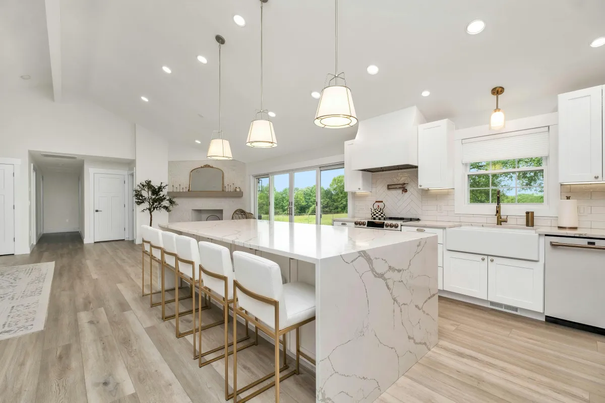 Open-concept kitchen remodel featuring marble countertop and stainless appliances in LA home