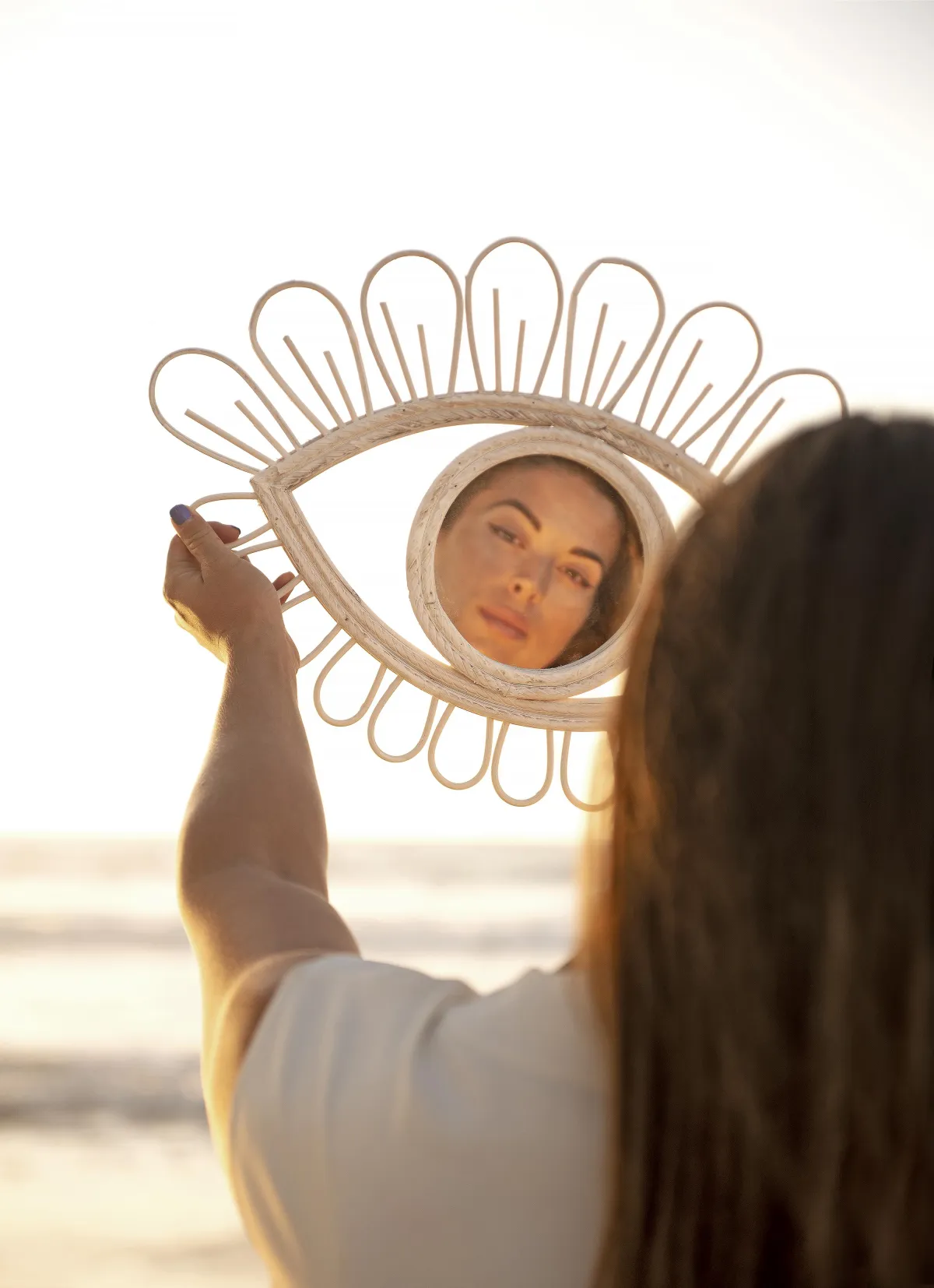 Reflection in mirror symbolizing transformation, self-connection, and intimacy coaching by Denver sex and relationship coach Michelle Feuerstein