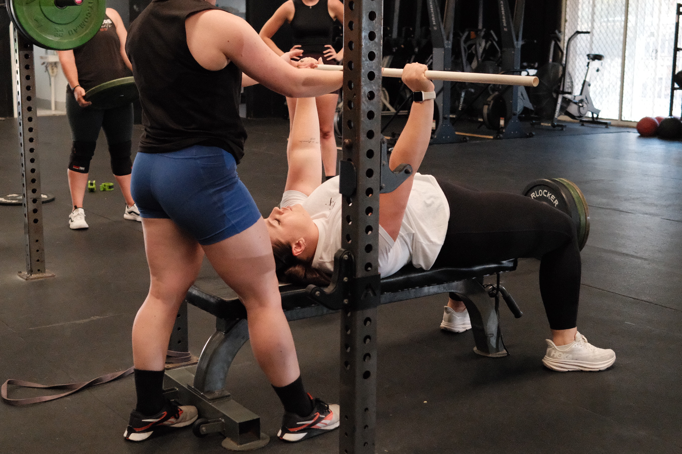Woman practicing yoga in a modern living room.