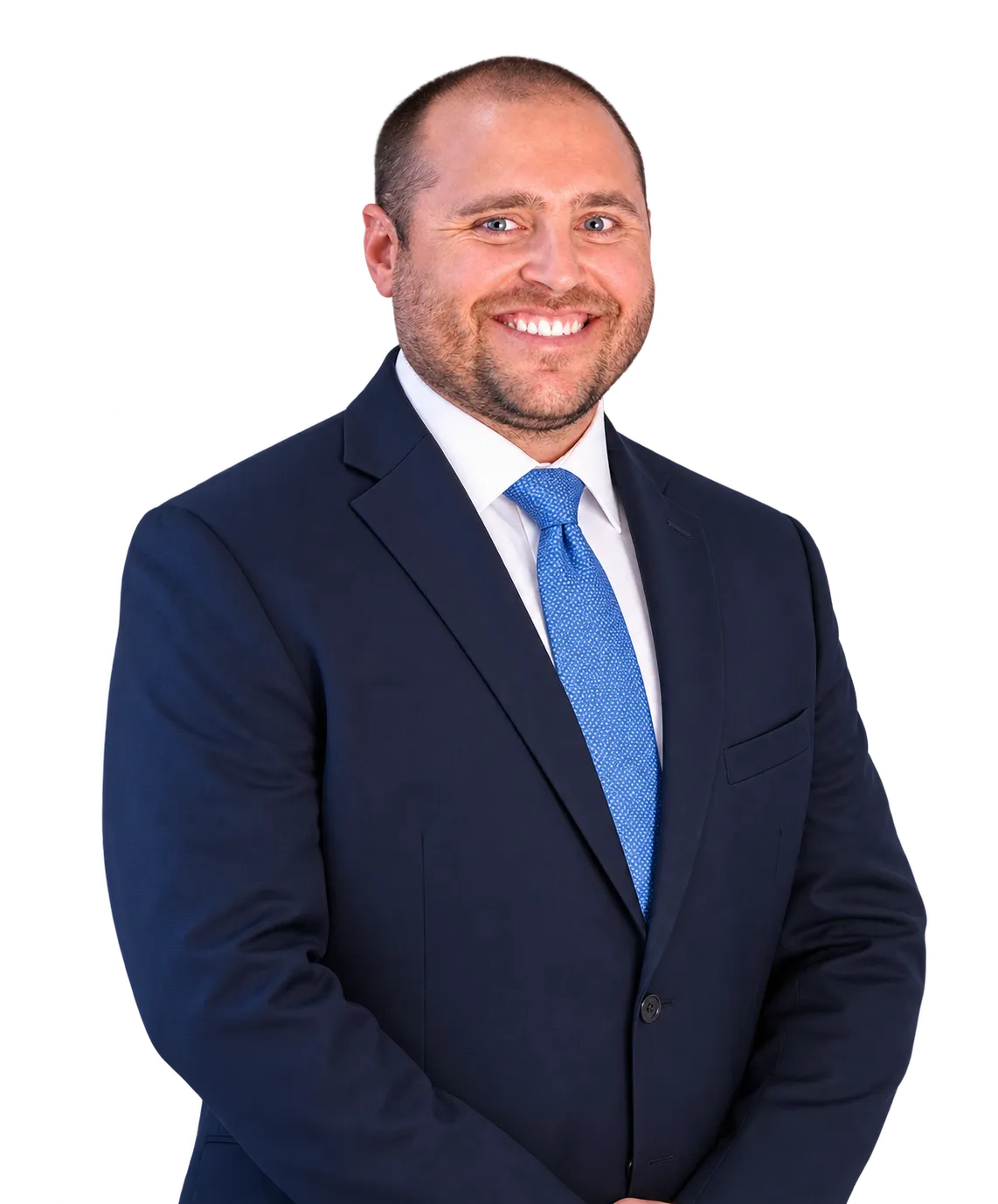 Portrait of Chris Reece in a blue suit and tie, smiling.