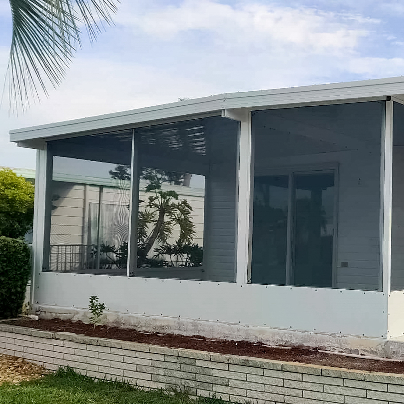 Screen enclosure around a lanai