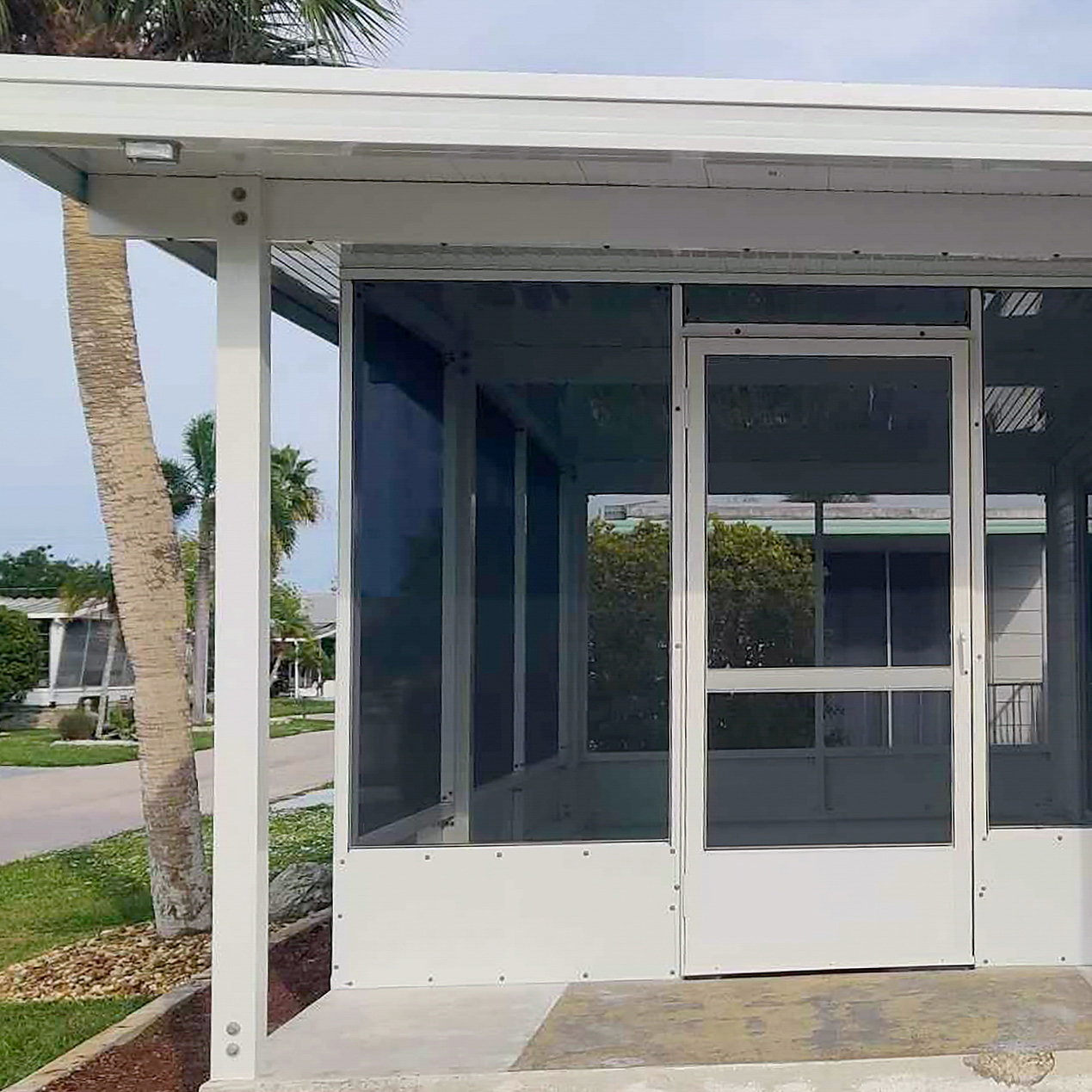 Outdoor screen enclosure installation on a Florida property