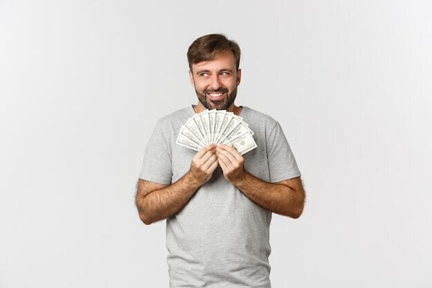 a man holding a pair of wrenches in his hands
