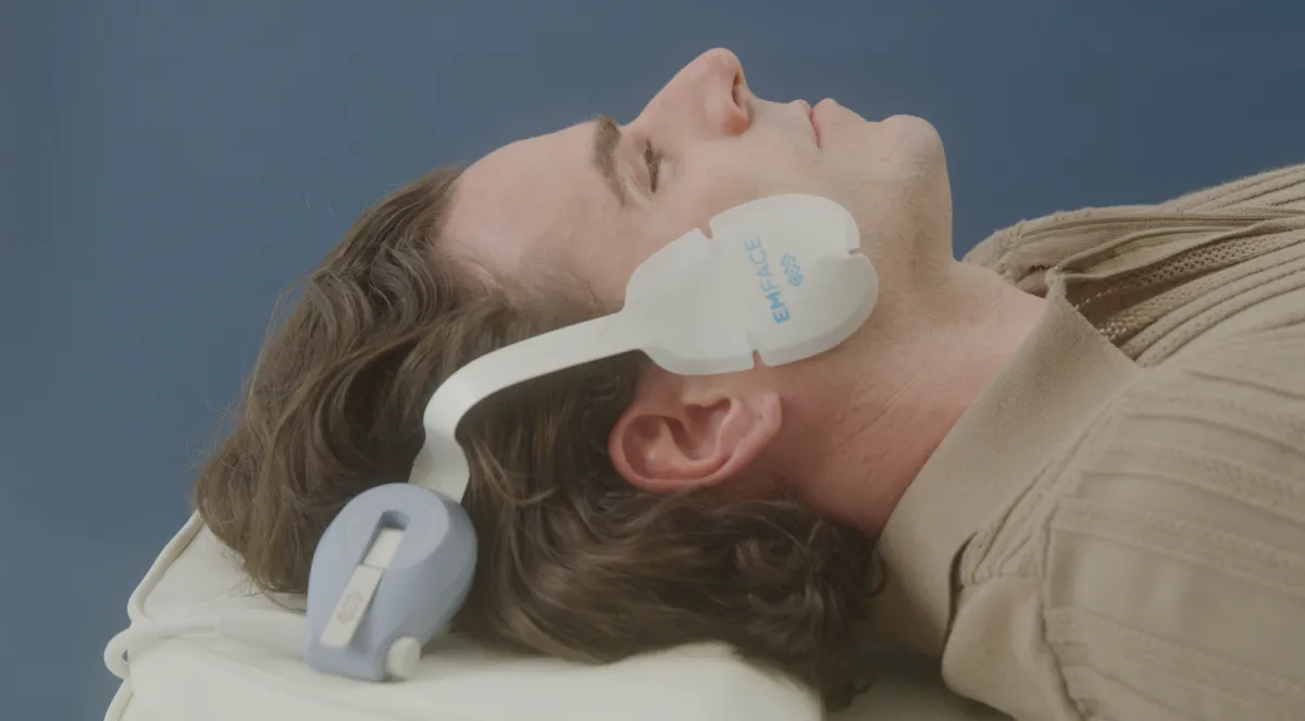 man with emface machine
