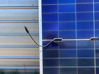 Integrated solar microgrid showing modular PV and battery storage on a working farm