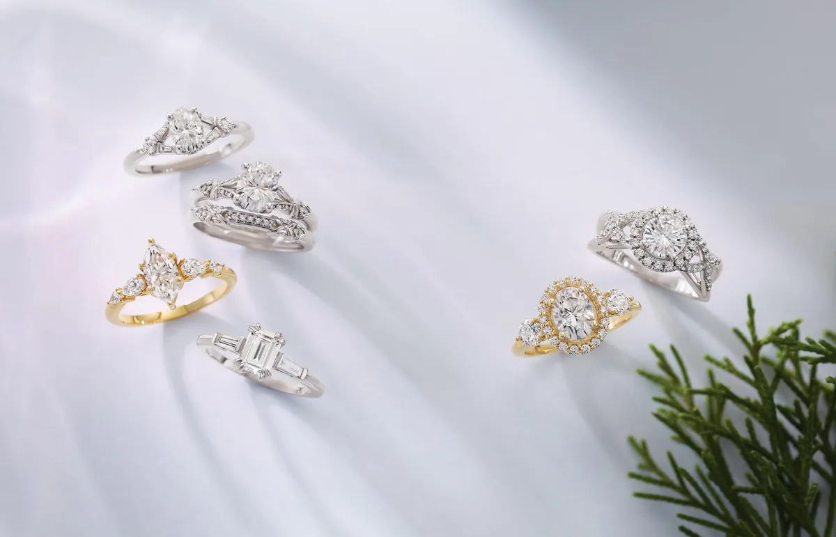 silver diamond ring on gray stone