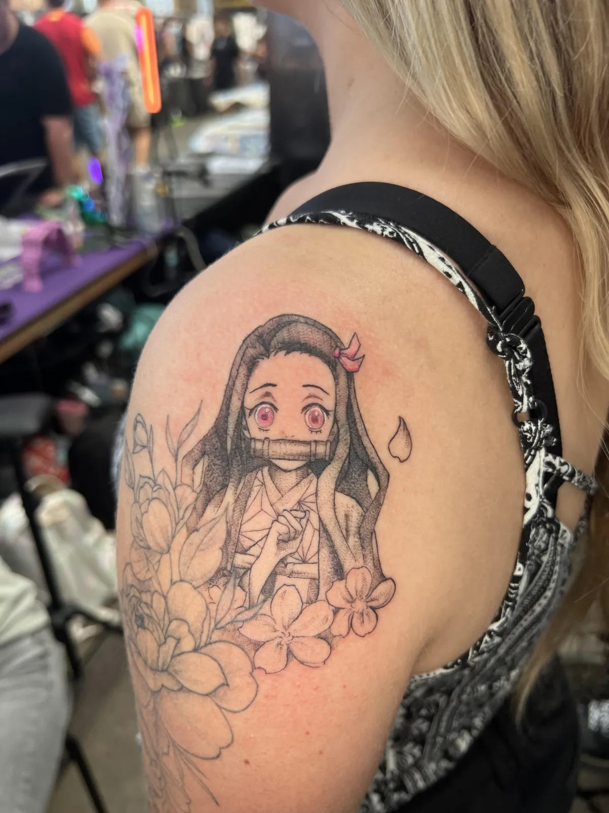 person with tattoo on right arm