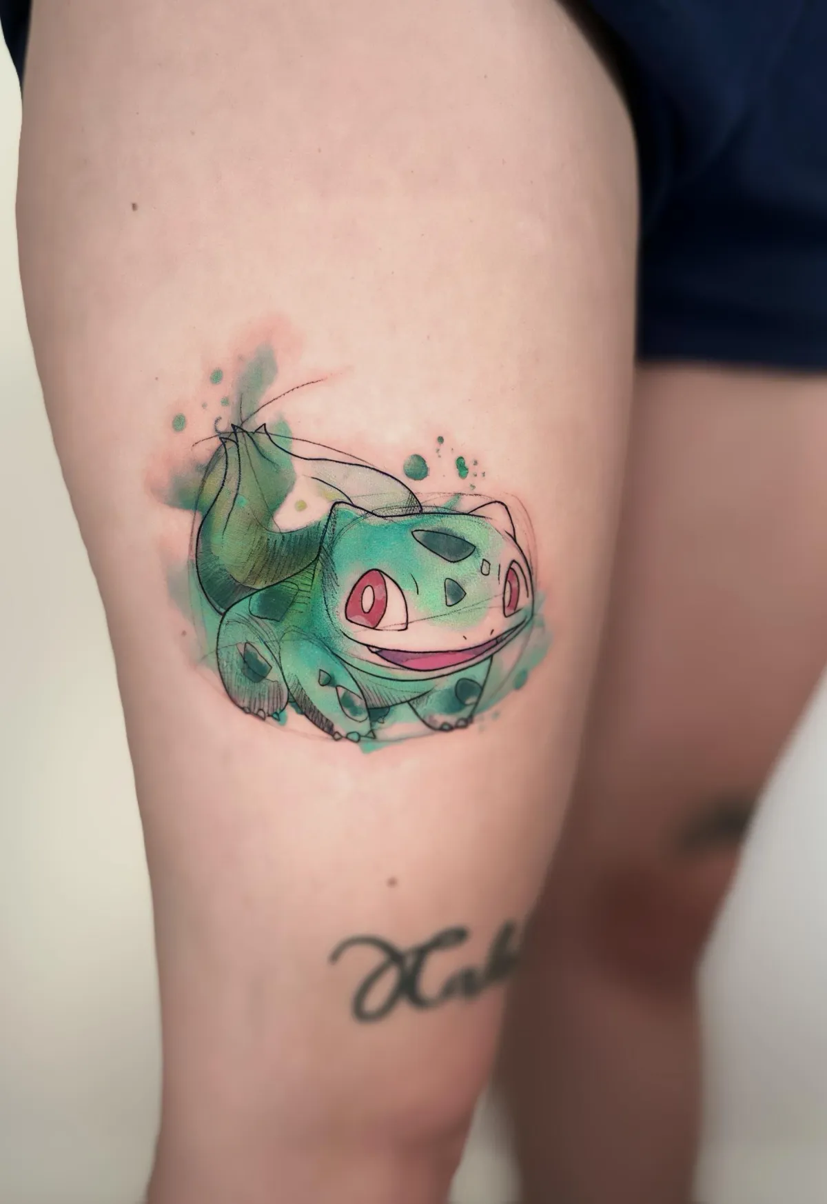 person in blue denim shorts and white nike sneakers standing on gray concrete floor