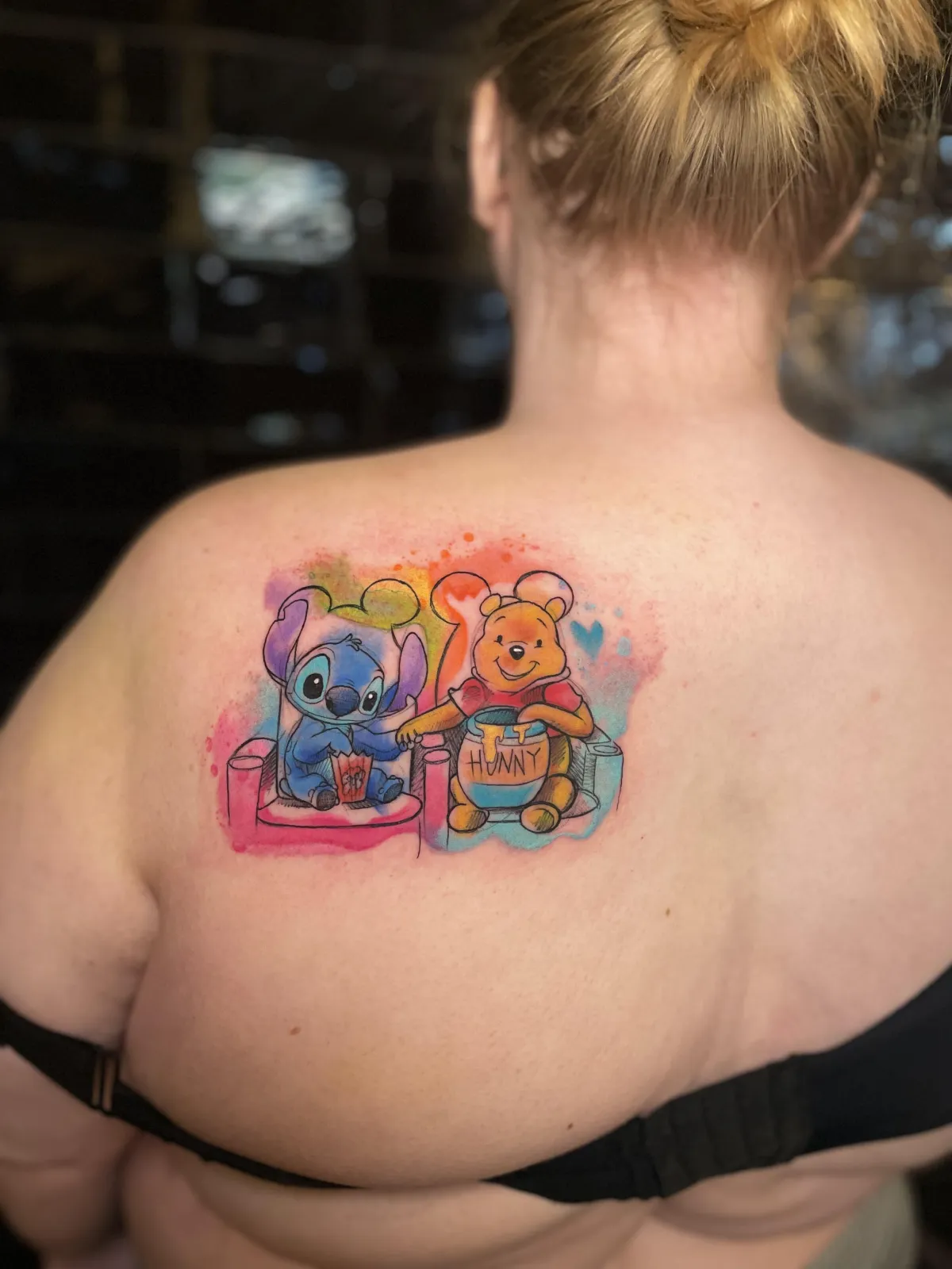 person with tattoo on right arm