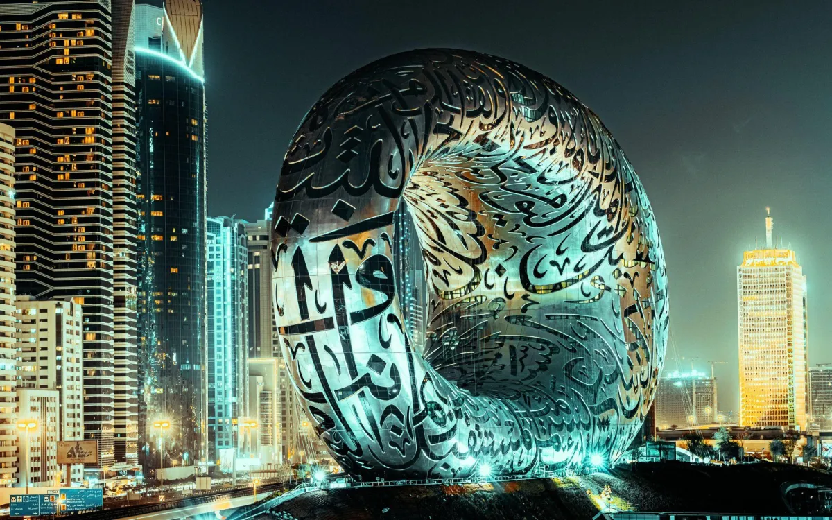 Dubai's illuminated skyline sparkles at night.
