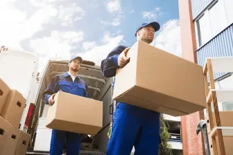 2 Men Carrying Moving Boxes