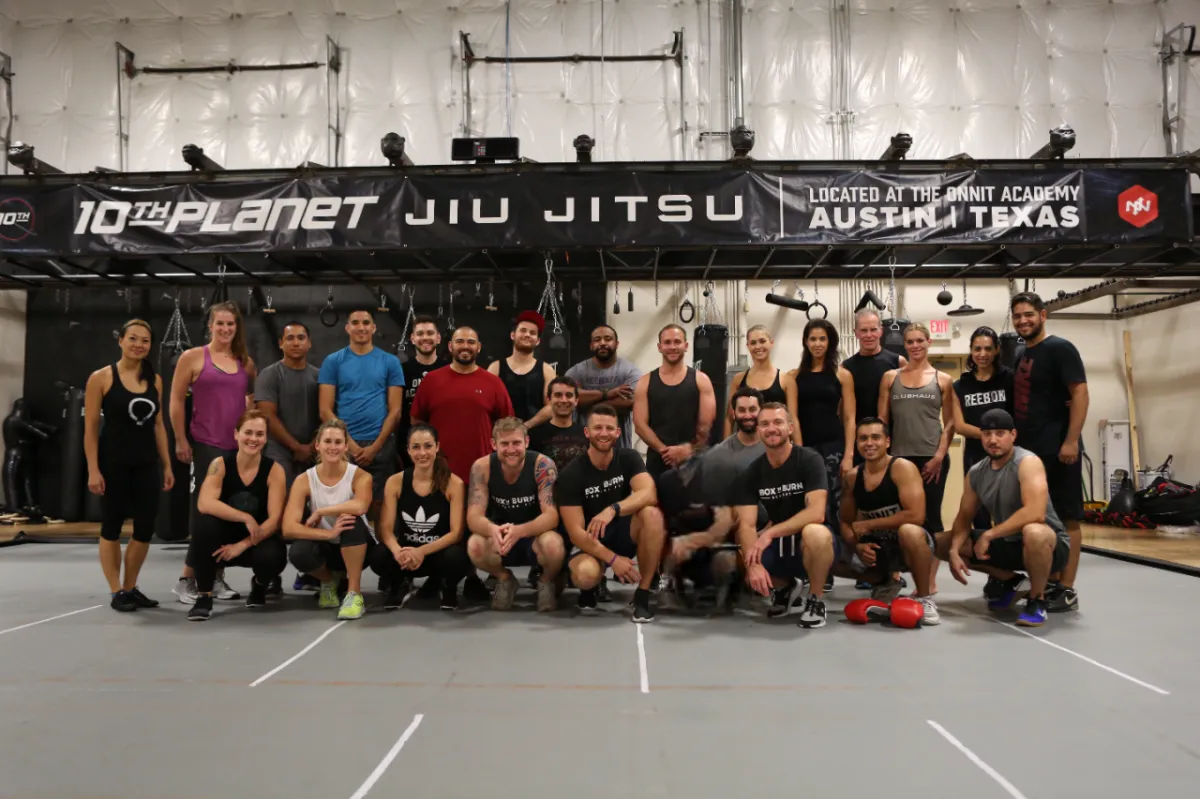Group of young personal trainers attending an in person boxing for fitness certification course in Austin, Texas taught by Tony Jeffries.