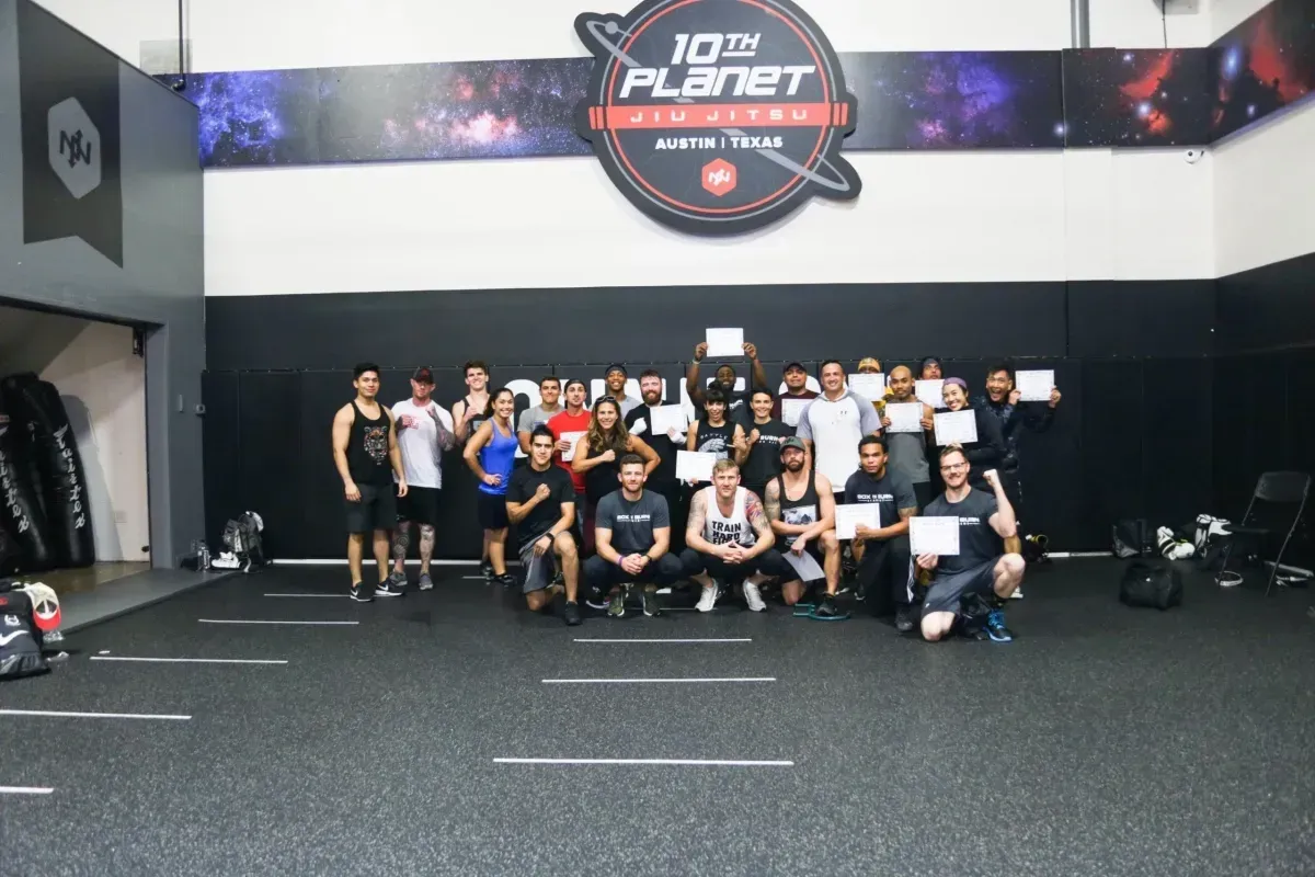 Group of young personal trainers attending an in person boxing for fitness certification course in Austin, TX taught by Tony Jeffries.