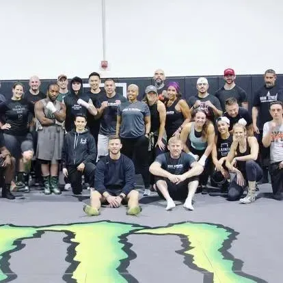 Group of newly certified boxing fitness trainers attending an in person boxing for fitness certification course taught by Tony Jeffries.