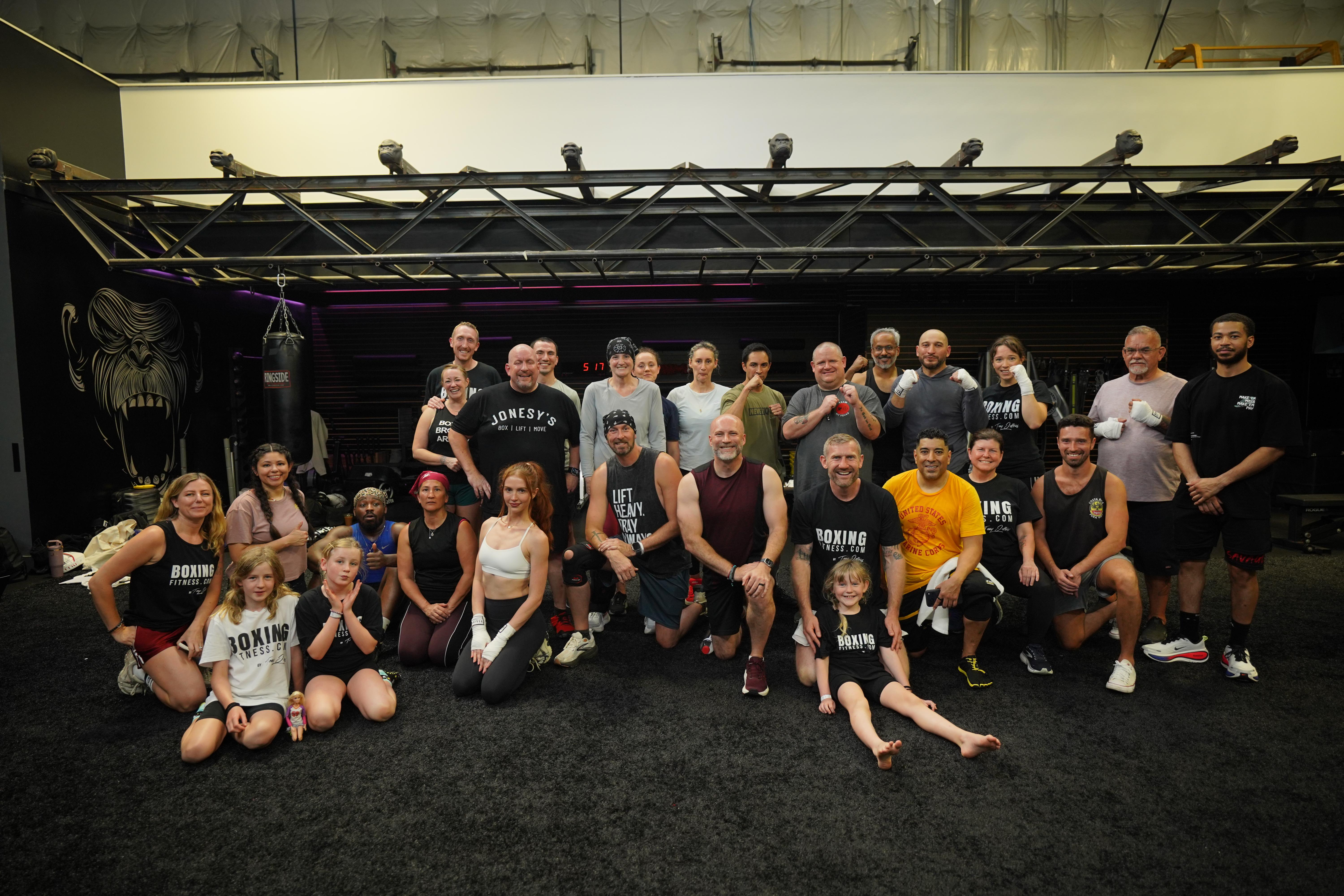 Group of newly certified boxing fitness trainers attending an in person boxing for fitness certification course taught by Tony Jeffries.