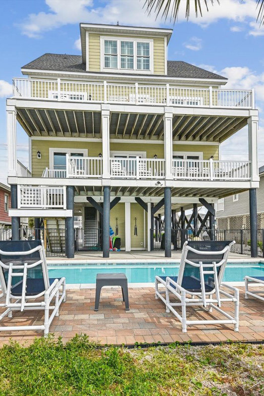 woman setting sheets on bed