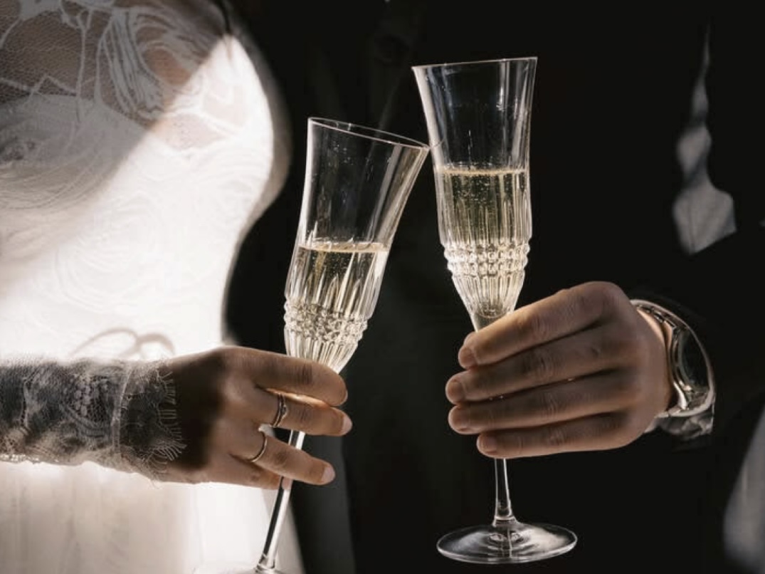 A woman in a yellow dress at a decorated table