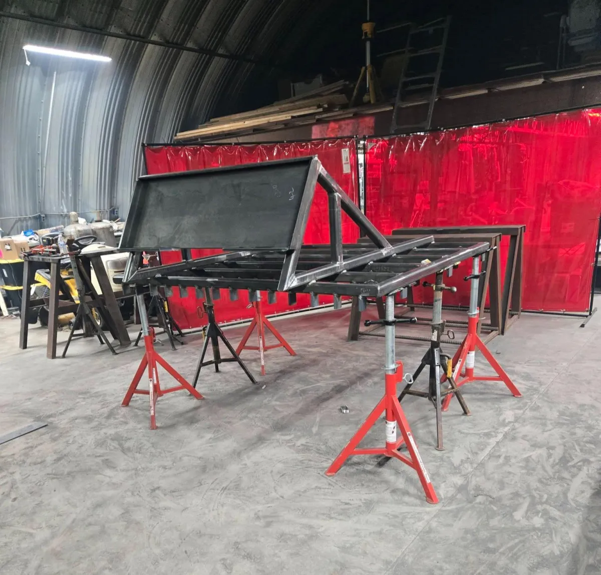 A metal ruler with black markings lies on a surface.