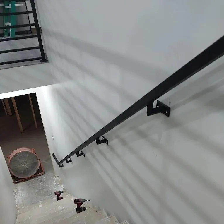 Two metal mechanical parts on engineering blueprints