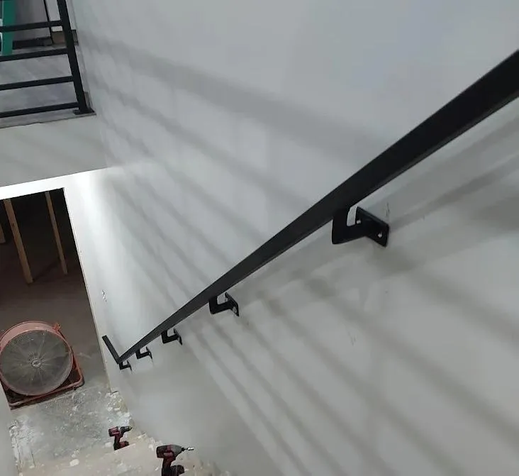 Two metal mechanical parts on engineering blueprints