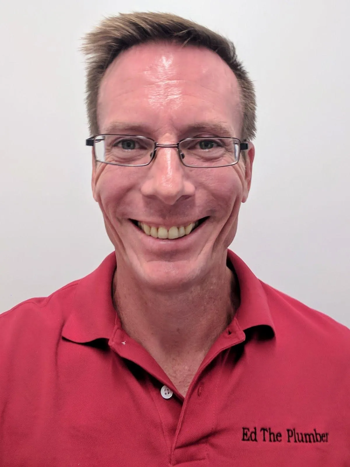 man holding phone white using MacBook