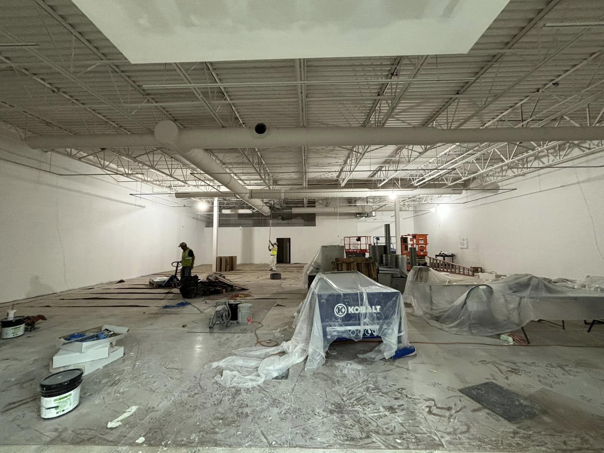 Professional painter working on commercial facility maintenance
