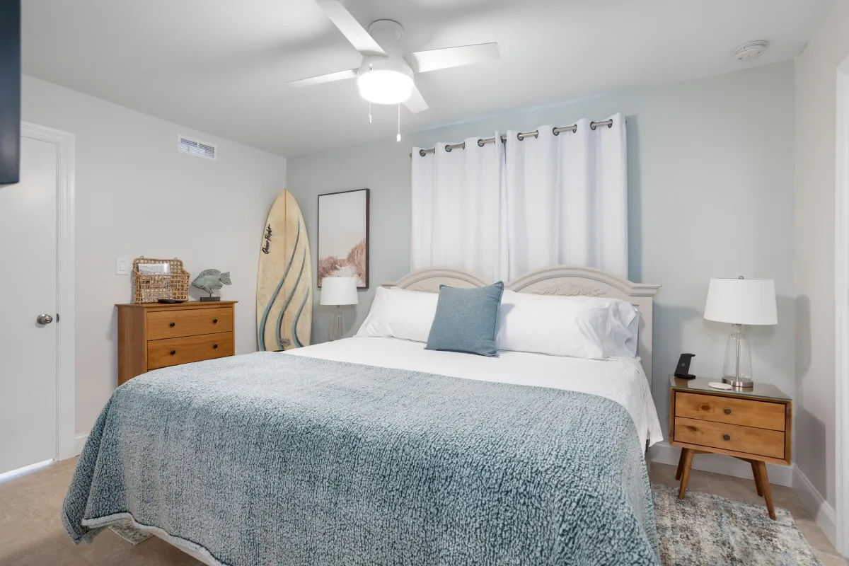 coastal bedroom with surfboard