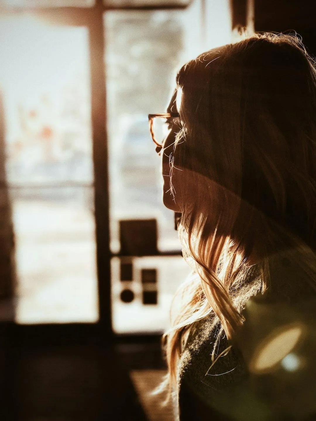 Women thinking at a window seat