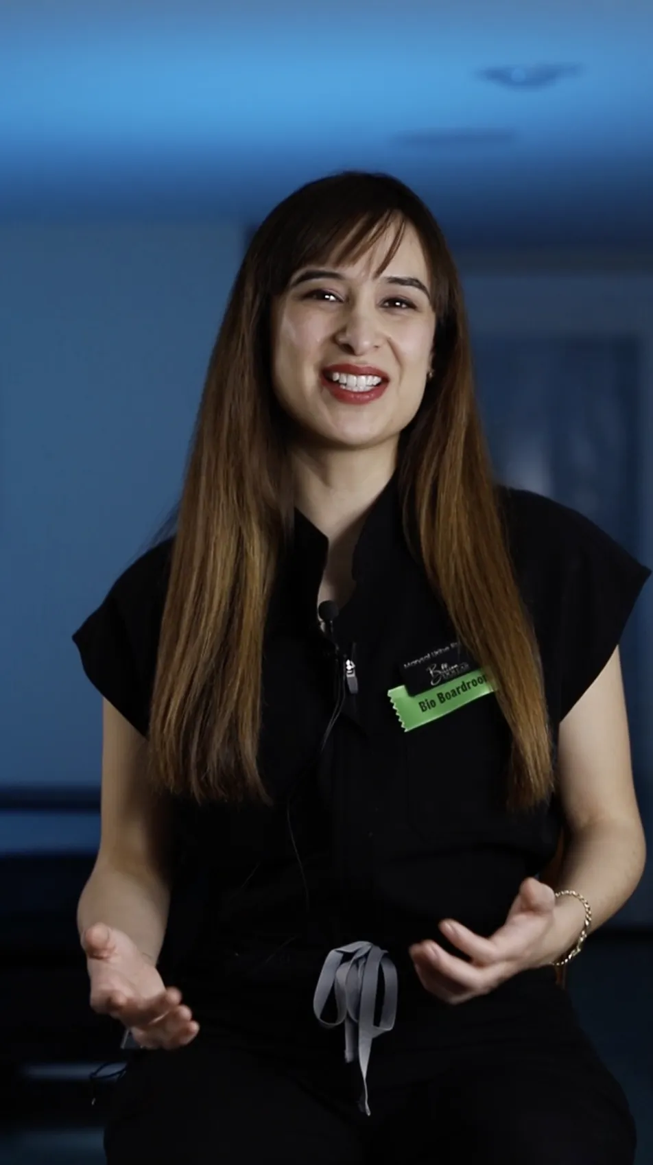 a white wall with a reflection of a light on it