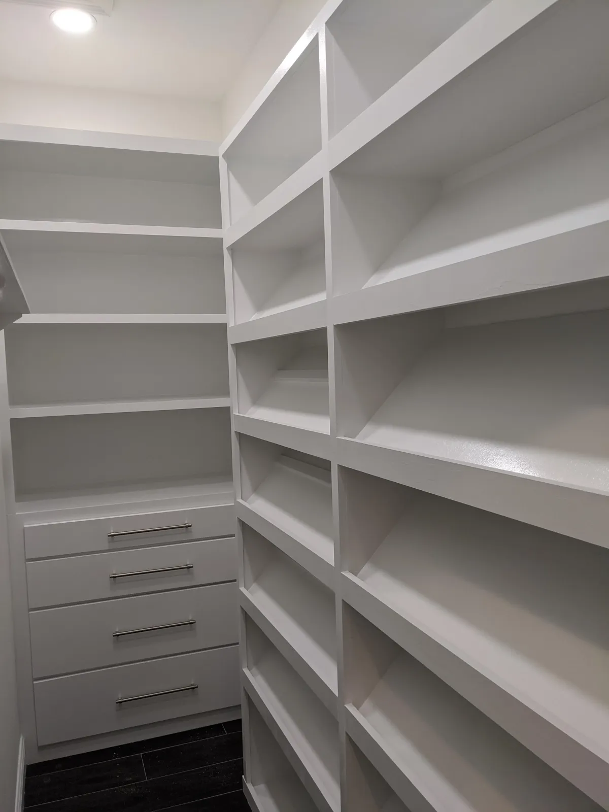 Person holds a white spray bottle overhead.