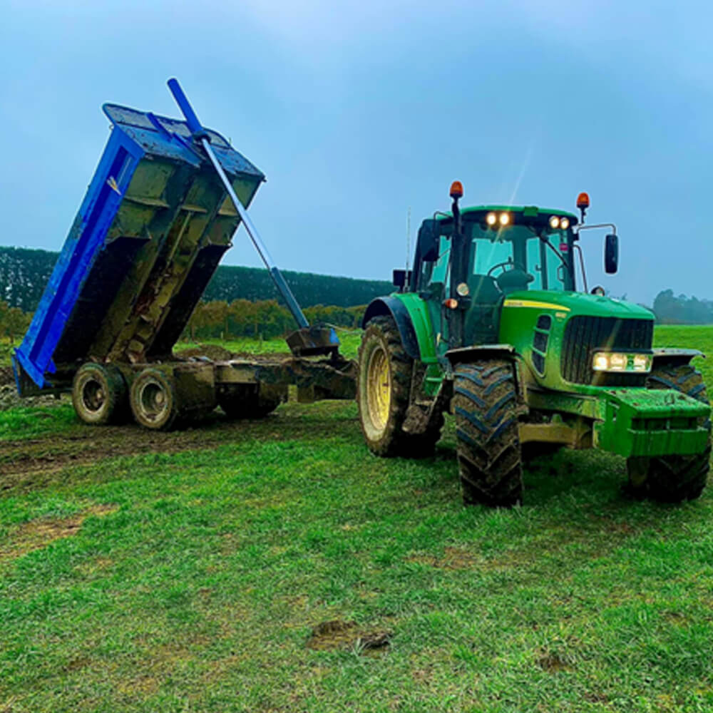 tractor and tip trailer tipping load Canterbury farm services