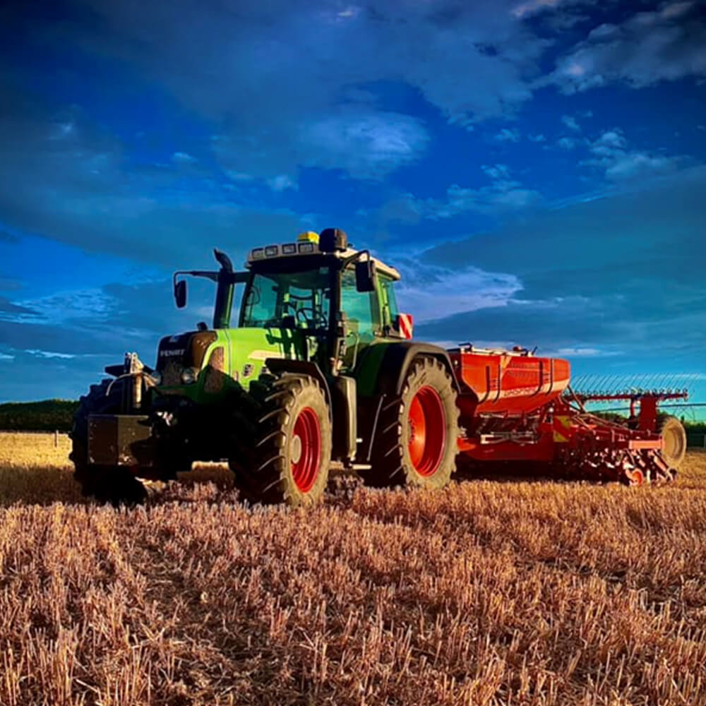 tractor seeding paddock Canterbury agricultural contracting sunset
