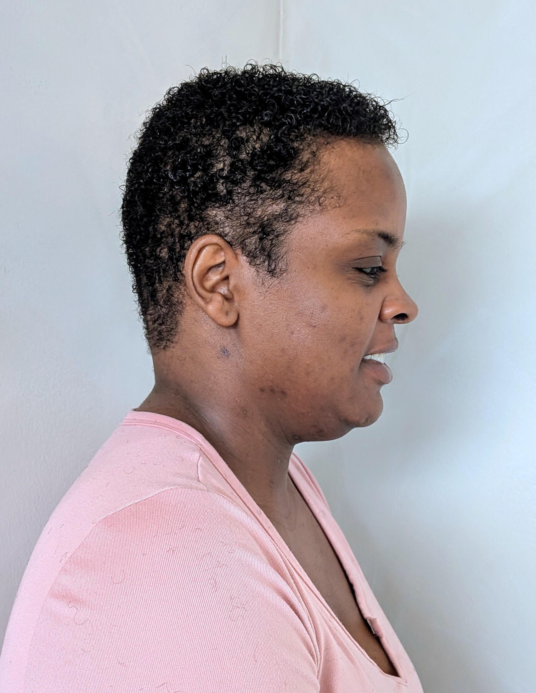 Natural hair reshape with healthy trimmed ends and improved silhouette.