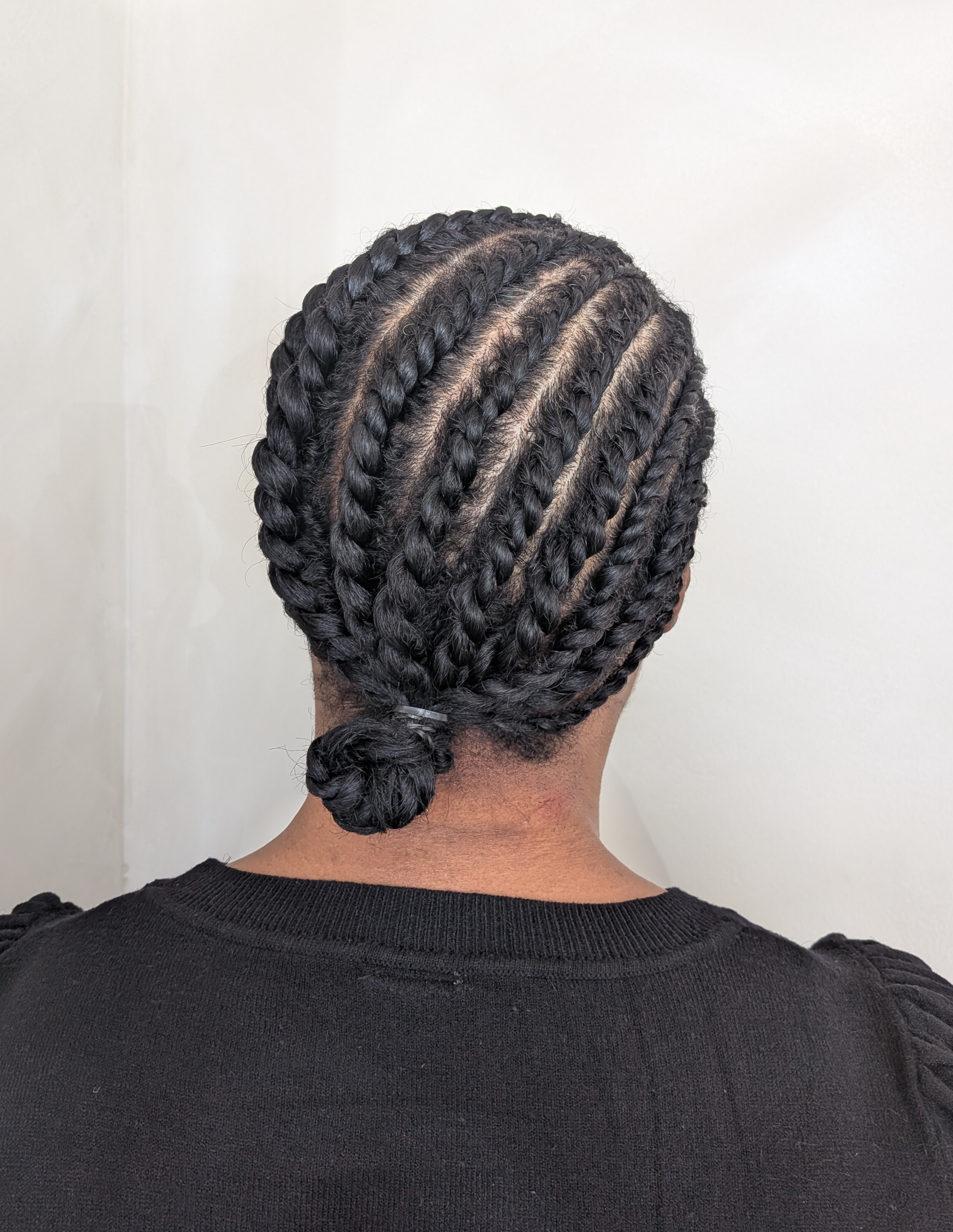 Flat twist protective hairstyle created on natural textured hair.
