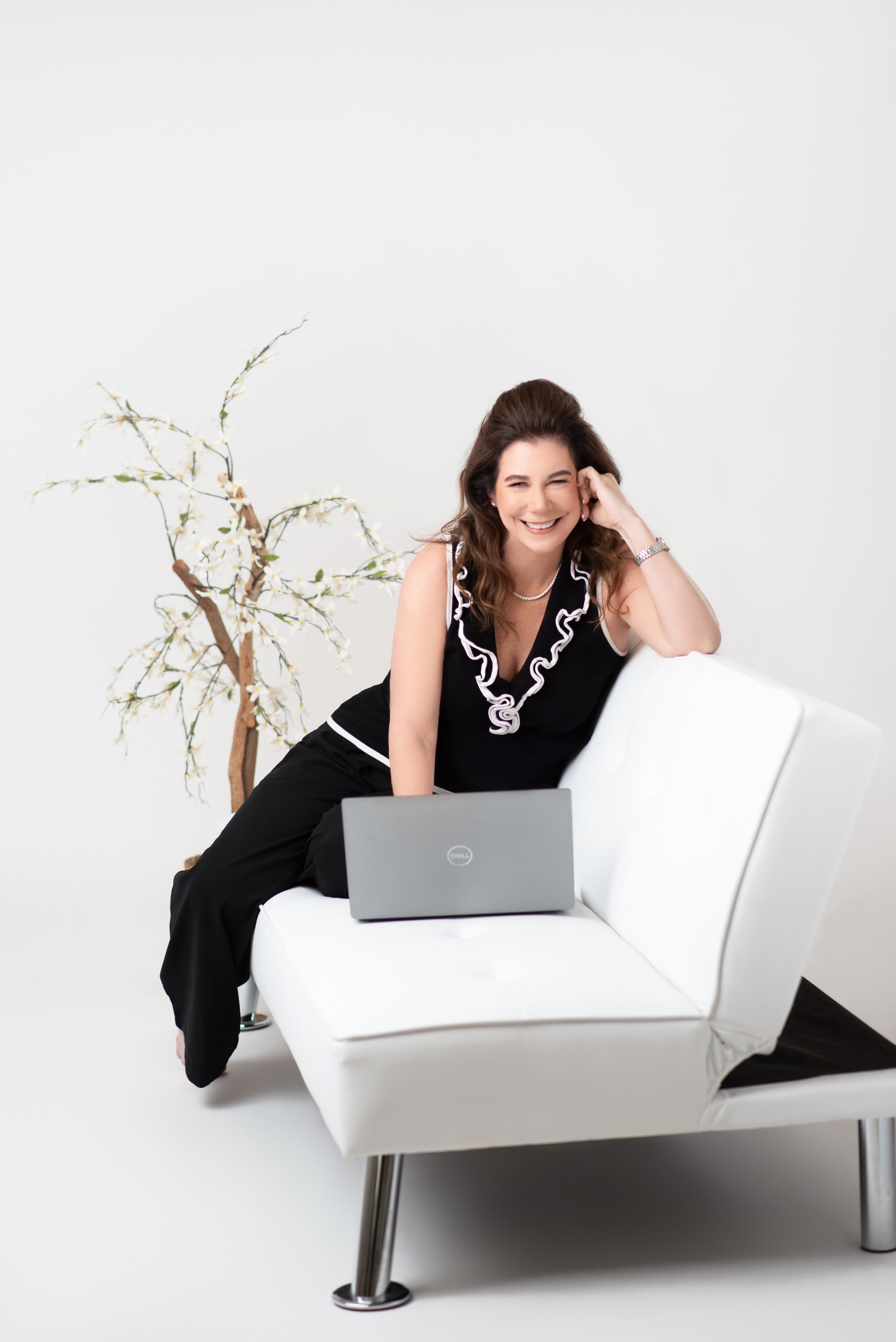 Portrait of a confident female founder seated, photorealistic style