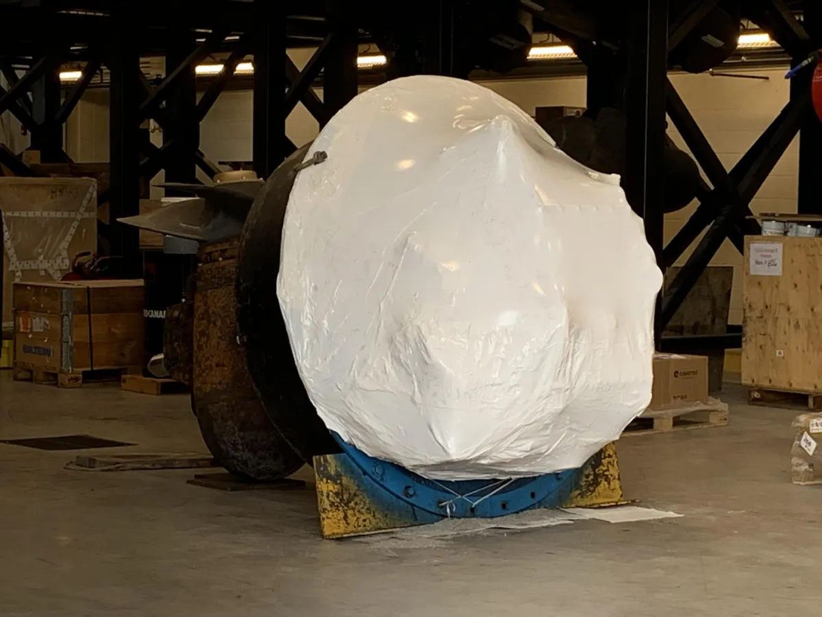 Industrial machinery shrink wrapping in progress at an Ontario manufacturing plant