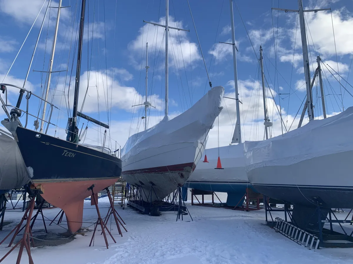Boat shrink wrapped for winterization at an Eastern Ontario marina