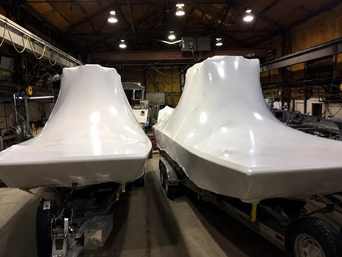 New-build patrol vessel shrink wrapped before shipment to customer