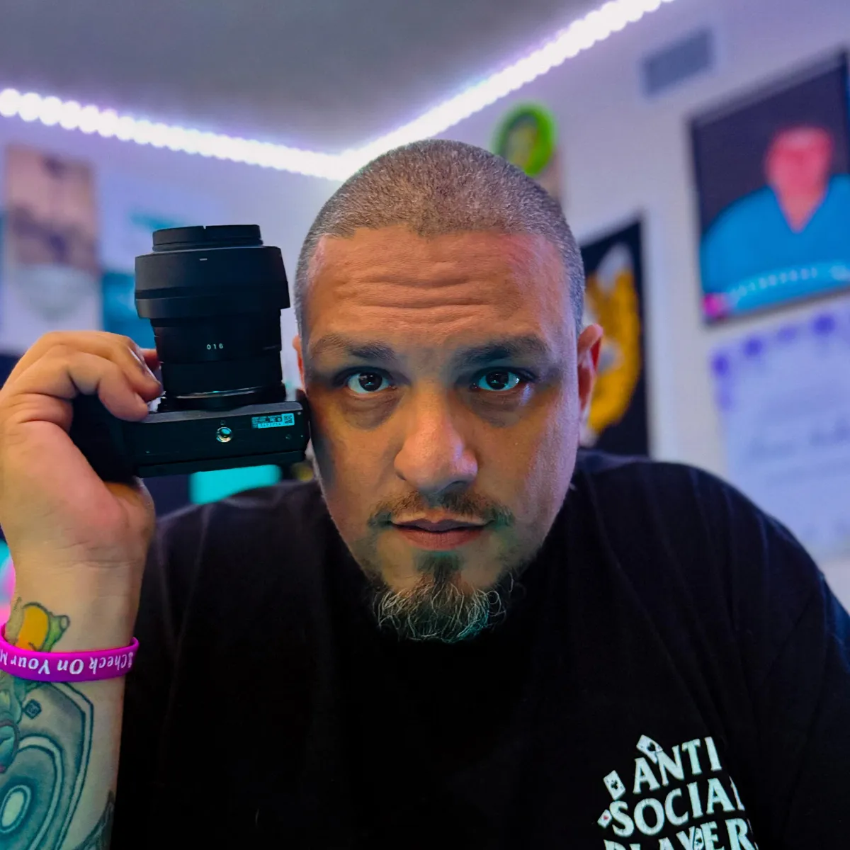Diverse team of photographers and videographers collaborating in a cozy studio, reviewing images on a laptop, surrounded by lighting equipment and props, conveying teamwork and creative energy.