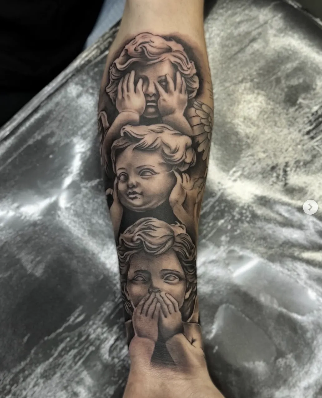 Chicano lettering and iconography tattoo by Tattoo's By Buck