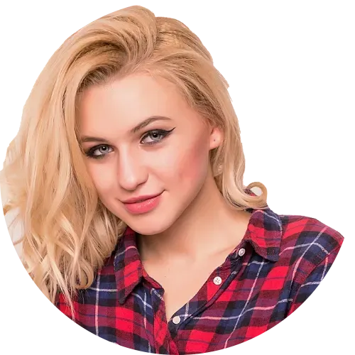 Smiling blonde woman wearing a red and navy plaid shirt.