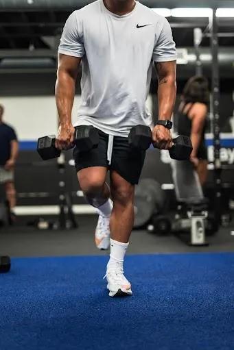 Hockey player using weights and balancing on one foot