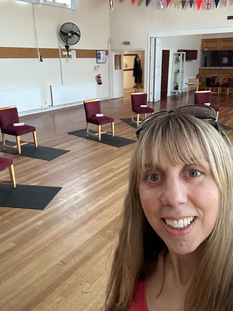 Becky, founder of Wellbeing for ME, certified Health and Wellbeing Coach and yoga teacher, in a calm relaxed setting.